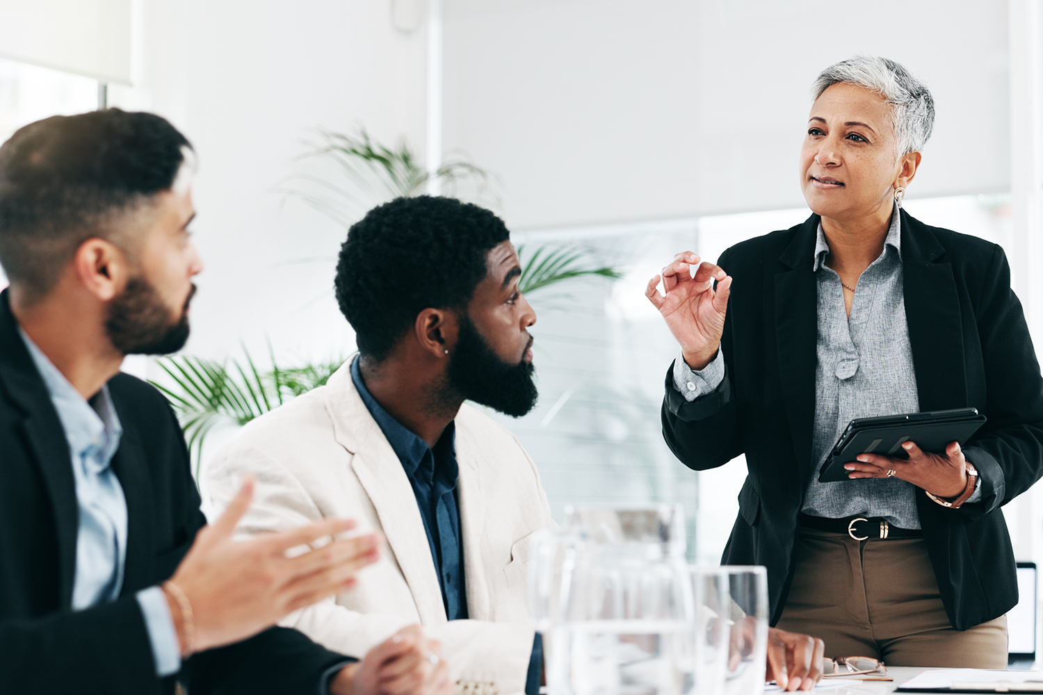 Presentation, coaching and meeting with business woman and tablet for research, training and project management.